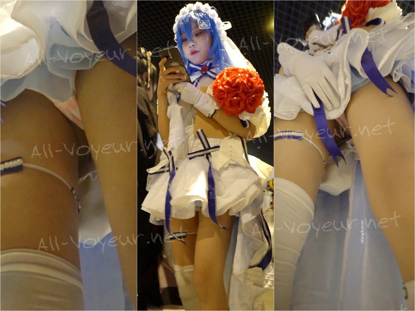 青い髪の少女はウェディングドレスを着ています。前面はステルスでいっぱいです。ピンクは覆われています